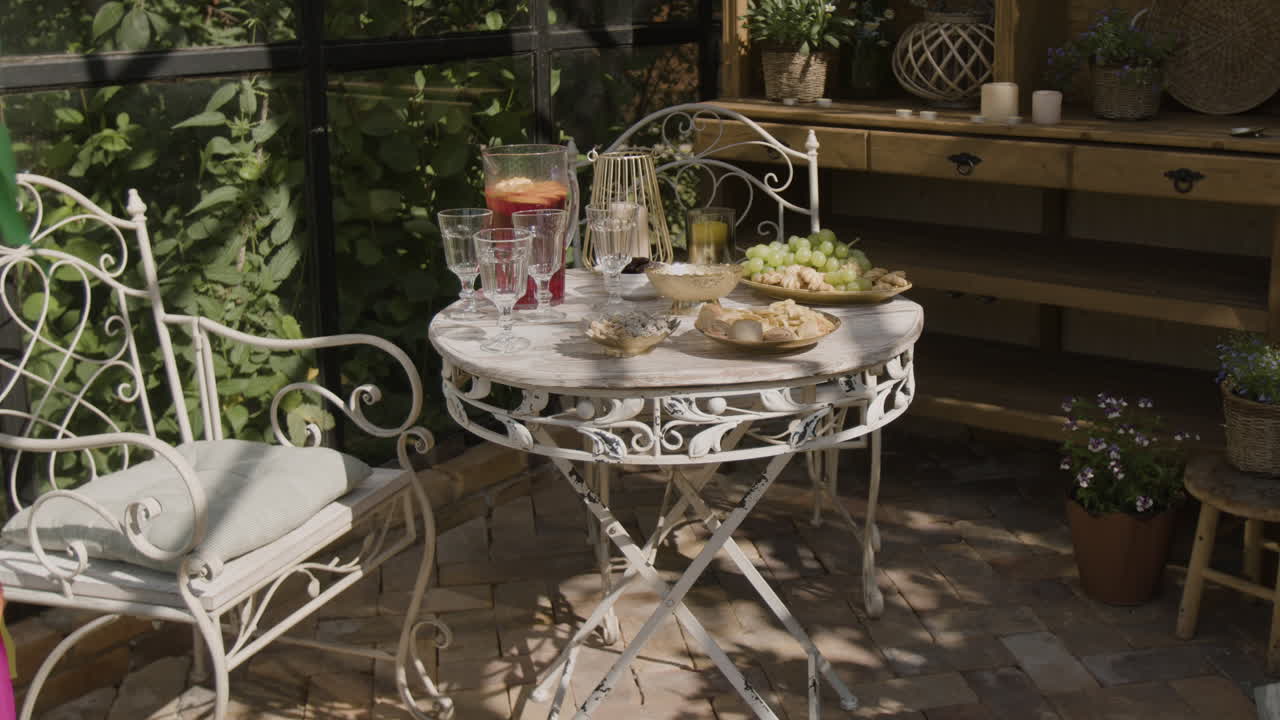 Cozy Outdoor Patio Setting with Refreshments and Snacks