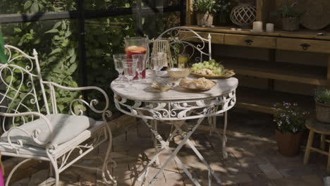 cozy outdoor patio setting with refreshments and snacks