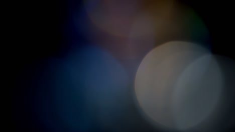 multicolored light leaks footage on black background, lens flare leak burst overlays transitions