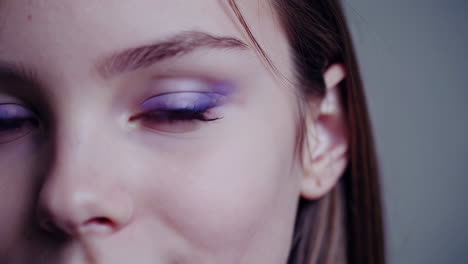 close-up of a girl with makeup and blue eyes