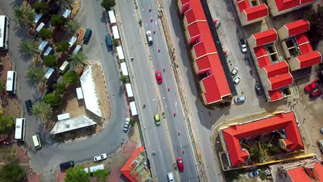 overhead view of cars passing through the streets of willemstad, curacao, dutch caribbean island