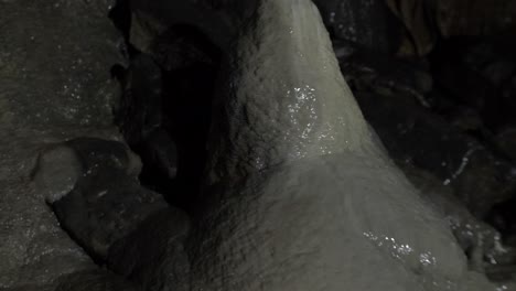 big stalagmite in a stalactite cave