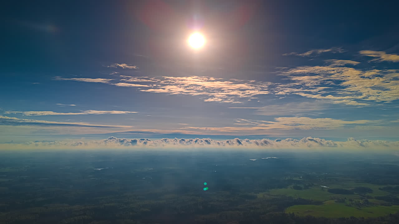 Sunshine over the Earth with a cloudscape time lapse in the high- altitude atmosphere