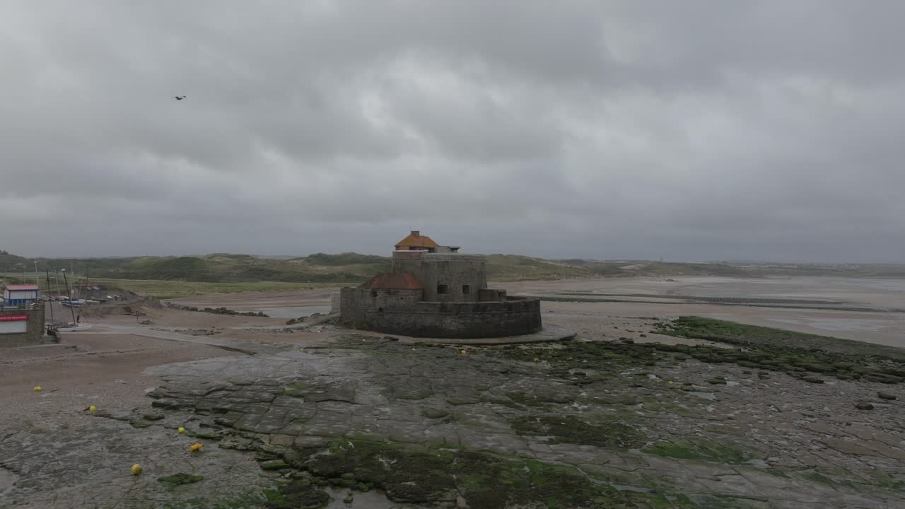 Drone shot of Fort D'Ambleteuse during low tide on stormy day