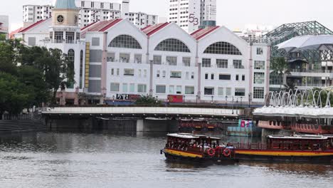 tourist boat cruising past riverside buildings