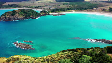 aerial view of maitai bay beach, karikari peninsula, waikato bay, and blue sea in new zealand