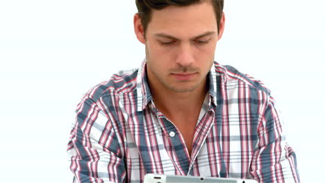 Smiling-man-using-tablet