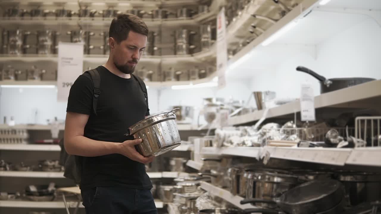 Man Shopping for Kitchenware in a Store