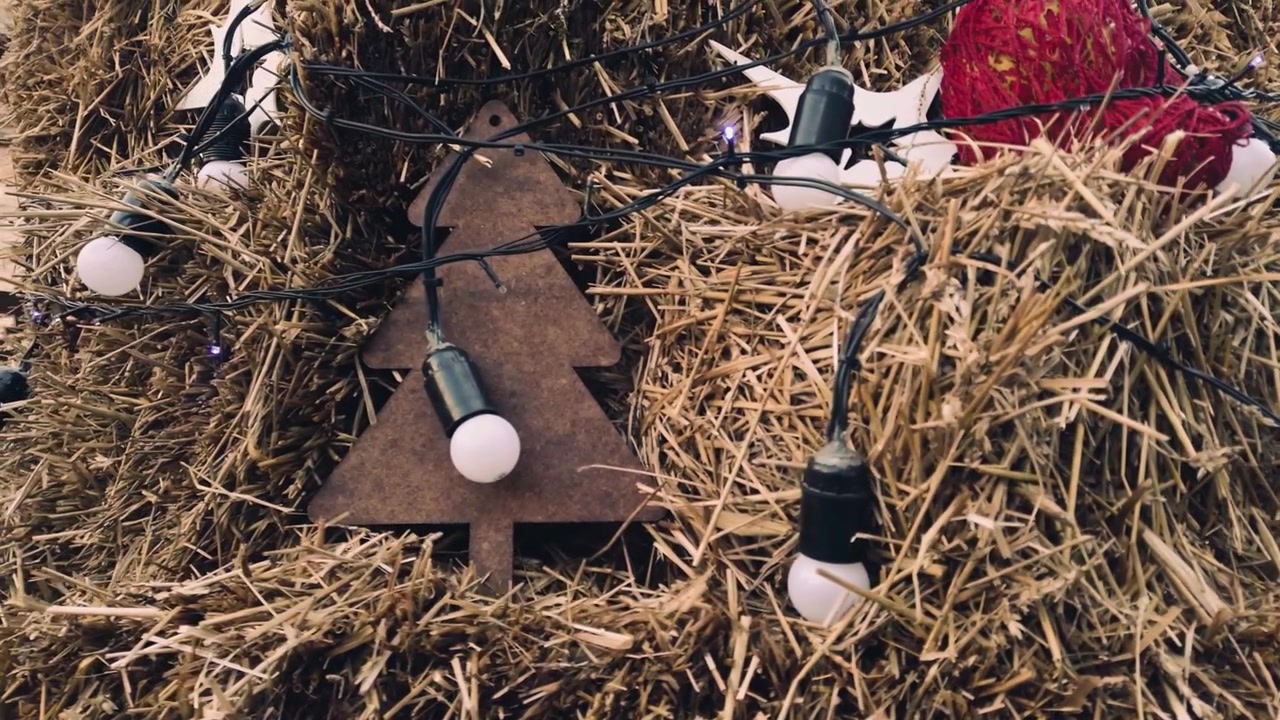 Christmas composition of hay and garlands.