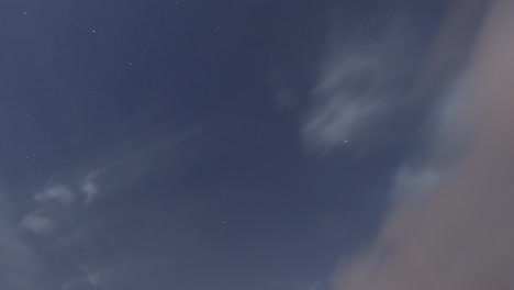 time lapse of bokeh moon light ray flare n golden star on dark night sky n white cloud
