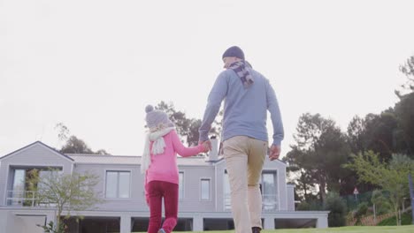 father and daughter walking in the lawn 4k