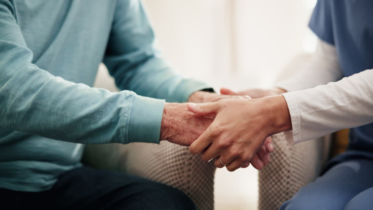 Nurse providing comfort and support to an elderly patient