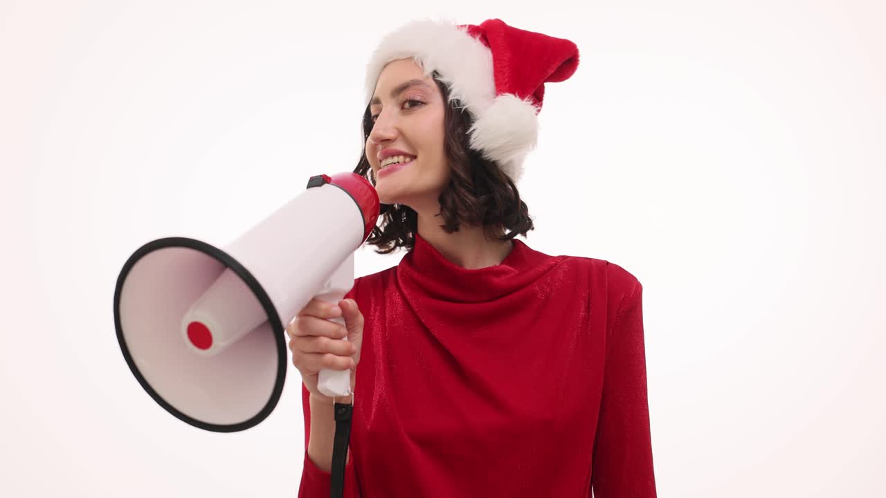 Woman in Santa hat with megaphone