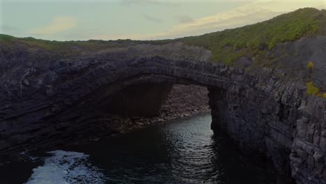 the bridges of ross at evening is a stunning natural sea arch in clare, ireland