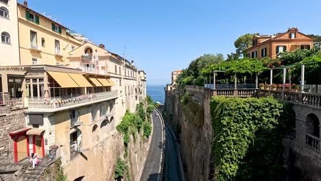 a picturesque street with buildings and greenery