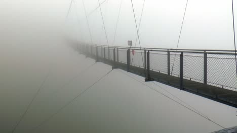 europe's highest suspension bridge in the fog