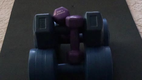 dumbbells on exercise mat