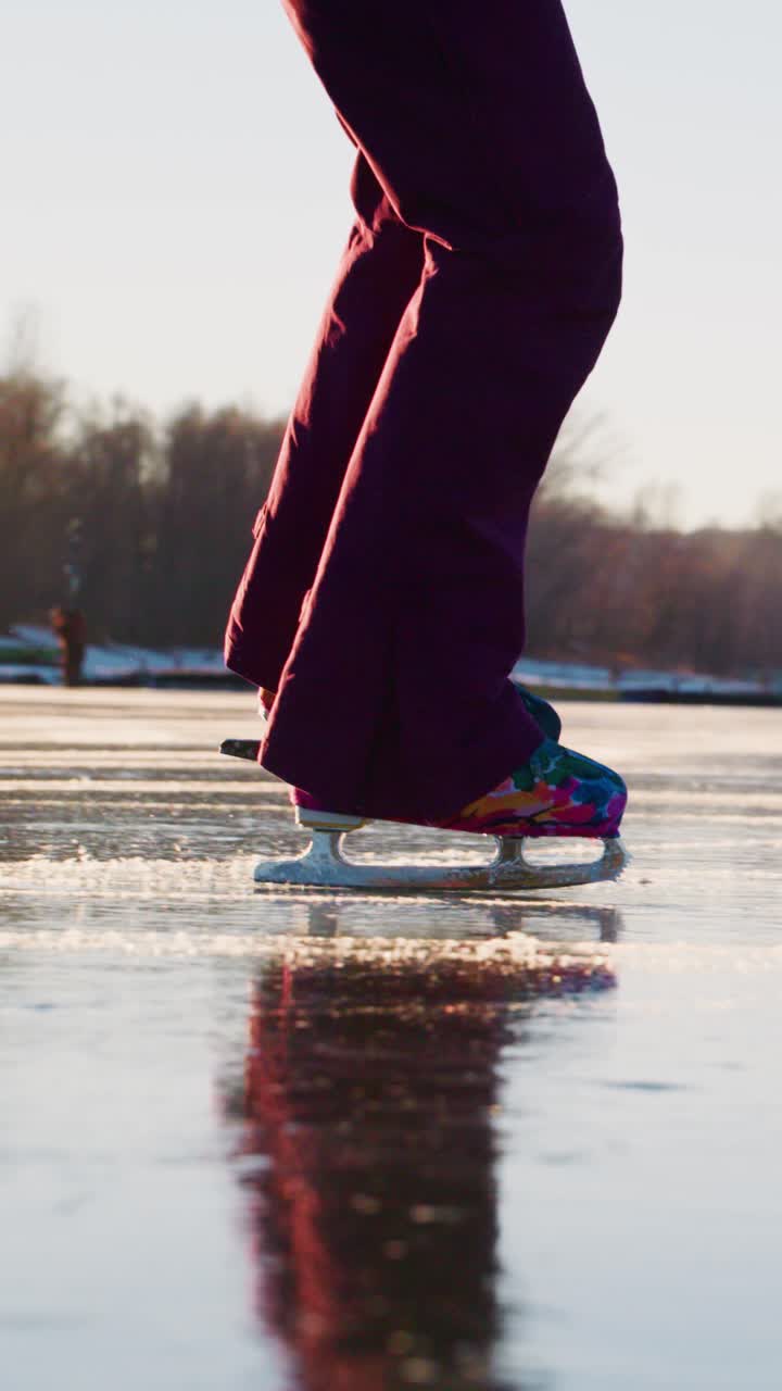 Graceful Movement on Ice: A Vibrant Ice Skater's Reflection Captured in Two Stunning Frames, Highlighting the Elegance and Skill of Gliding on a Frozen Surface in a Serene Natural Setting