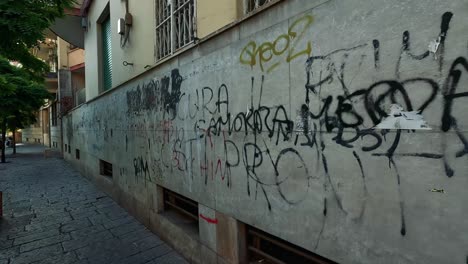 graffiti-covered wall in sorrento, naples, italy