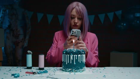 woman celebrating birthday with smartphone