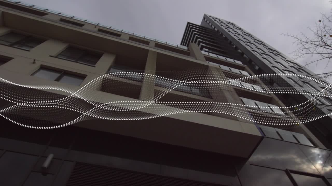 Animated overlay appearing over multistory building dotted waveforms waving and showing data flow