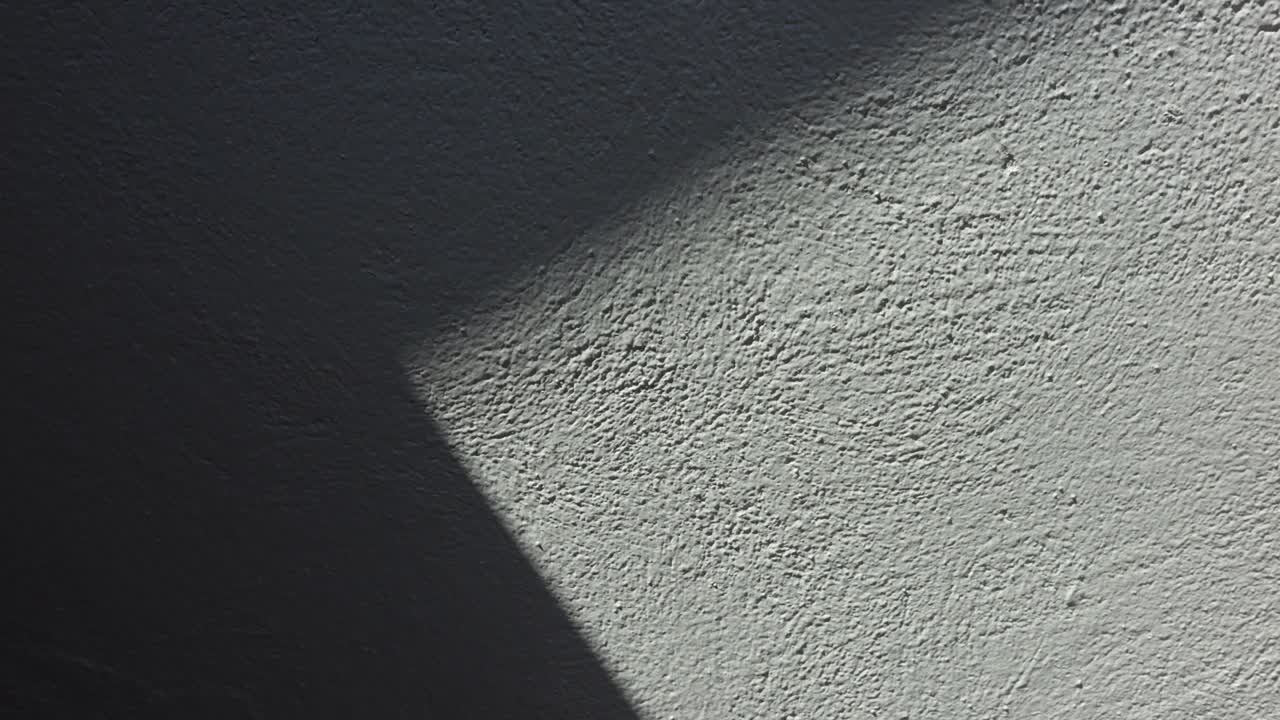 Shadow on white plaster wall time lapse video