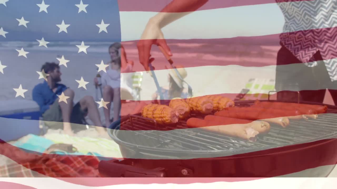 animación de la bandera estadounidense ondeando sobre amigos que tienen fiesta de playa de barbacoa en la playa junto al mar
