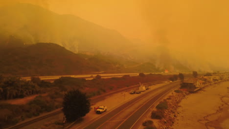 aerial of firefighters battling the huge thomas fire in ventura county along the 101 freeway