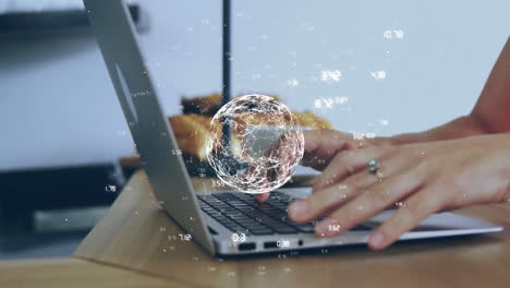 typing on laptop keyboard, digital globe and data points animation over hands