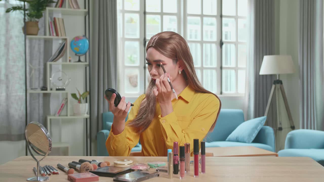 Influencer Young Transgender Woman Blogger Talks About Makeup. Blogger Talks Facial Beauty Treatments. Vlogger Broadcasts How To Use Of Cosmetic In Home Studio