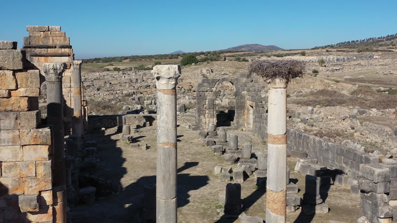 Volubilis, an ancient Roman city in Morocco, flourished between the 3rd century BCE and 3rd century CE, known for its mosaics, temples, and role as a key administrative and trade center