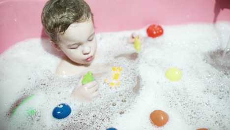 boy playing in the bath