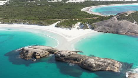 excellent aerial shot of clear blue surf cresting on the white beaches of wylie bay, esperance, australia