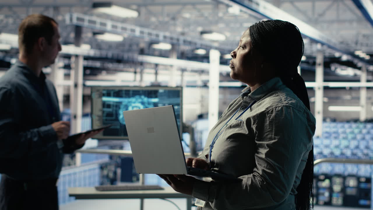 Data Center Admin Monitors Deep Learning Process With Laptop