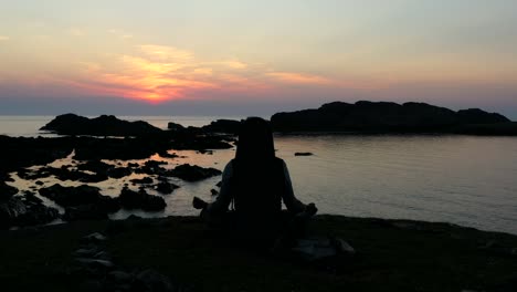 magical sunset, silhouette of man meditating