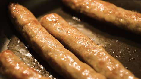 fried sausages in a pan