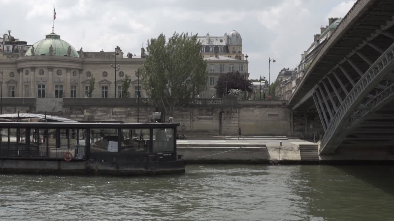 SLOW MOTION: Great perspective of Paris shot on boat cruise on river Seine