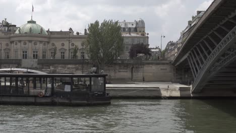 slow motion: great perspective of paris shot on boat cruise on river seine