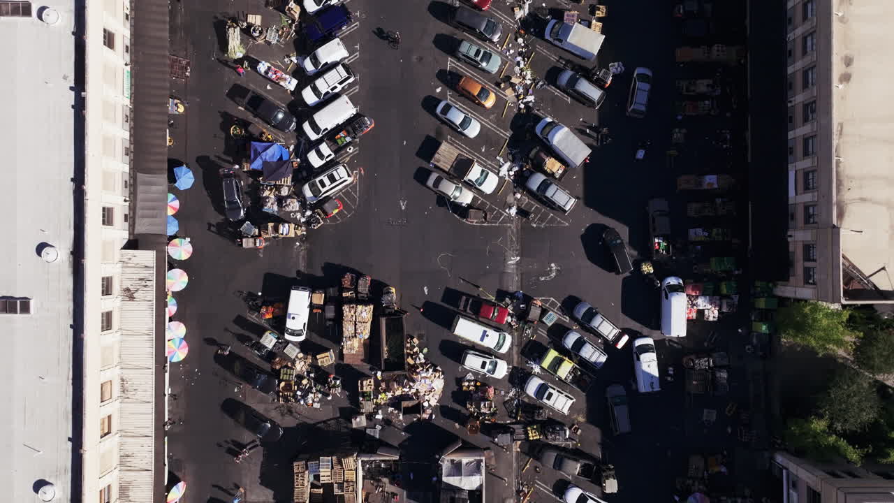 Aerial View of a Bustling Outdoor Market and Parking Lot