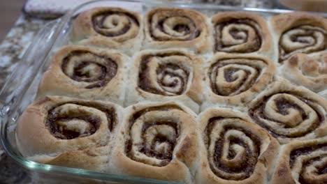 overhead view of freshly baked cinnamon rolls hot from the oven