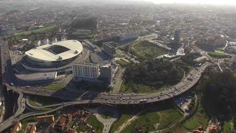 Aerial-view-overlooking-the-FC-Porto-football-stadium,-Estadio-de-Dragao-arena,-in-Oporto-city,-Portugal---High-angle,-drone-shot-02