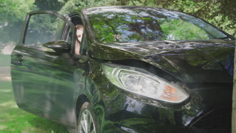 Woman-Getting-Out-Of-Smoking-Car-And-Inspecting-Damage-After-Accident