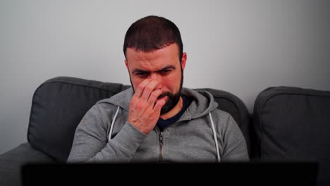 Middle-Eastern-Man-With-Beard-Seriously-Working-On-His-Laptop-At-Home