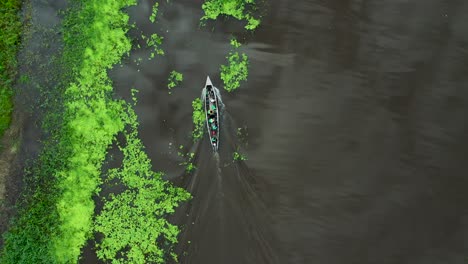 tourists on jungle cruise boat on amazon river in peru - aerial