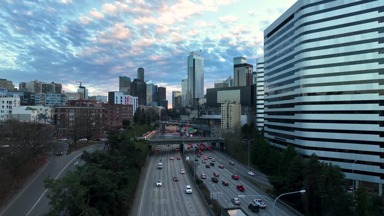 Aerial view of Seattle's main freeway filled with evening traffic on a glowing summer evening