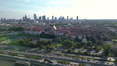 Aerial-panorama-of-Warsaw,-Poland-over-the-Vistual-river-and-City-center-in-a-distance-Old-town