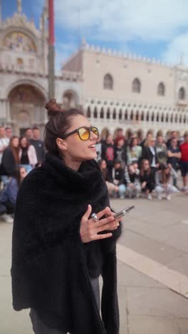 woman using phone in st. mark's square, venice