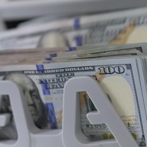 money counting machine. banknote counter are counting hundred dollar bills. close-up