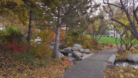 Handheld-Walking-Through-Park-with-Waterfall-Waterfront-Park-Kelowna