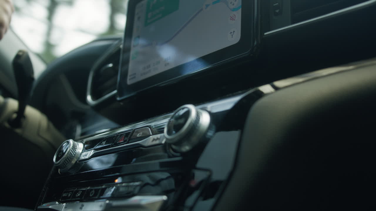 The car radio gleams with polished perfection, its sleek surface reflecting surrounding scenery and illuminating the interior, blending with captivating reflections of the world outside.